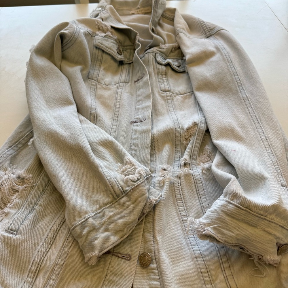Oversized long distressed denim jacket
